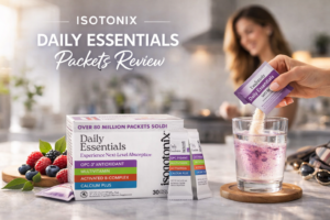 Isotonix Daily Essentials packets being poured into water in a clean kitchen setting