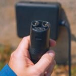Close-up of an EV charging connector plug