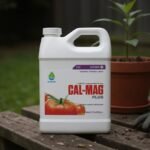 Botanicare Cal-Mag Plus jug on a garden bench