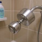 Sprite Slim-Line 2 inline shower filter mounted on a shower arm