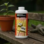 General Hydroponics CALiMAGic bottle on a garden bench