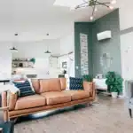 Mitsubishi Hyper-Heat indoor unit mounted on a wall in a real living room