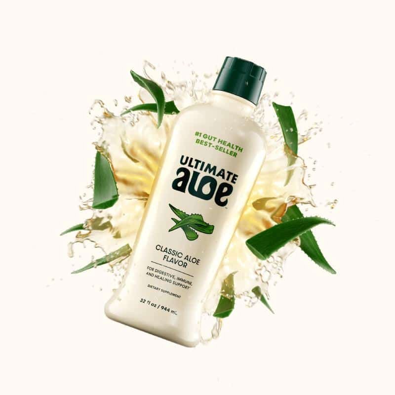 Isotonix Ultimate Aloe bottle with a splash of the concentrate and aloe leaves